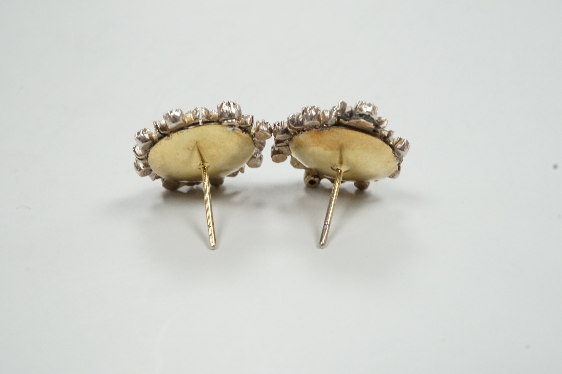 A pair of yellow and white metal, rose cut diamond cluster set earrings (lacking butterflies), diameter 21mm, gross weight 13.4 grams (adapted?).